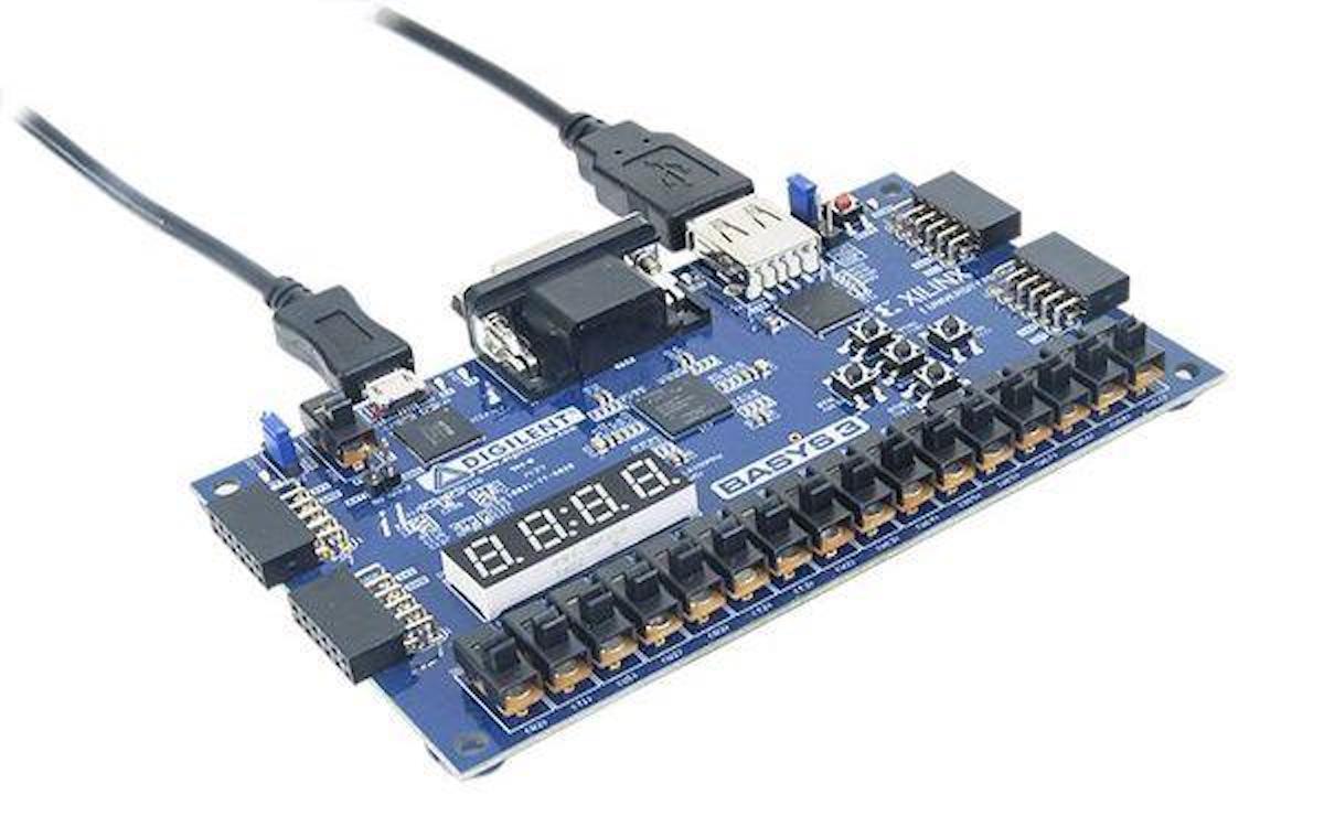 Blue FPGA Basys 3 Artix-7 board with microcontrollers, sensores, módulos, and USB cables connected for electrónica and. - FPGA Basys 3 Artix-7 - Microbot México - Default Title