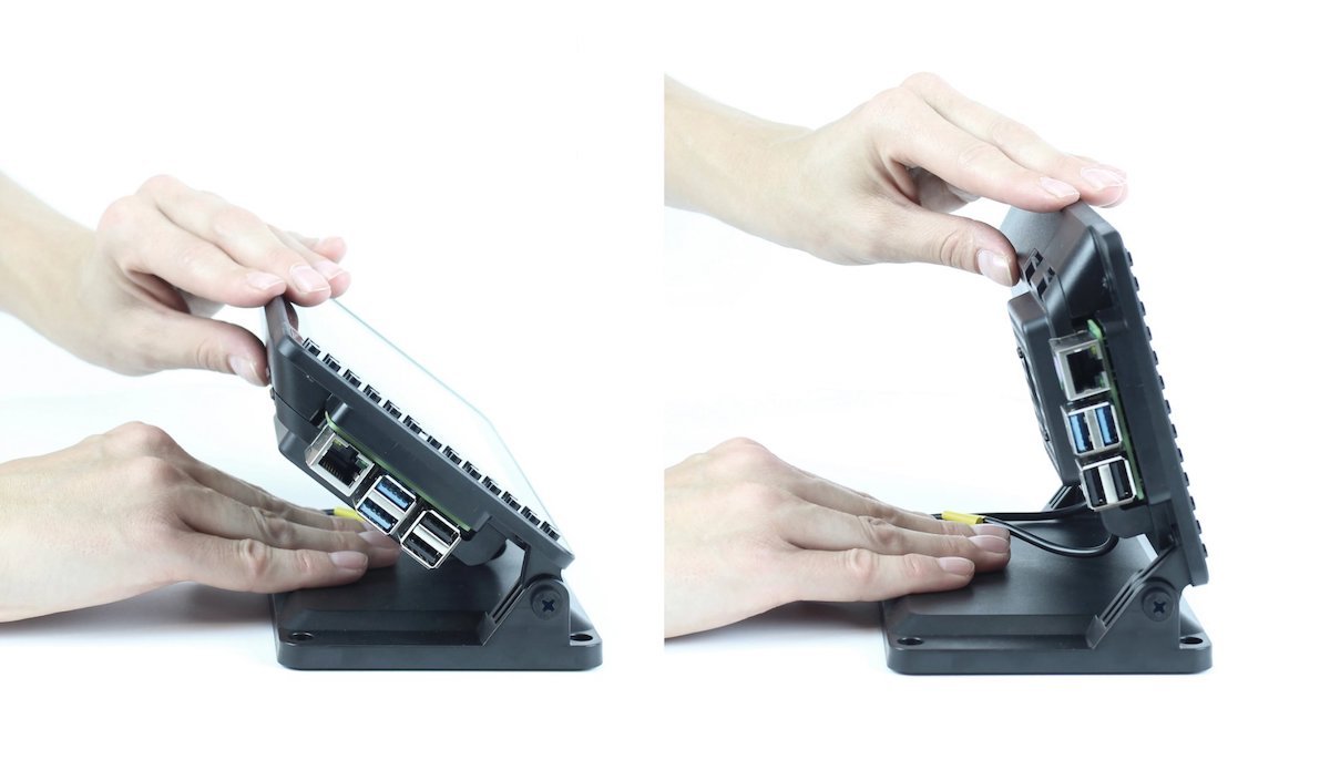 Black SmartiPi Touch 2 case for Raspberry Pi with touchscreen, held and adjusted by hands, showcasing ports and internal. - Carcasa SmartiPi Touch 2 - Microbot México - Default Title