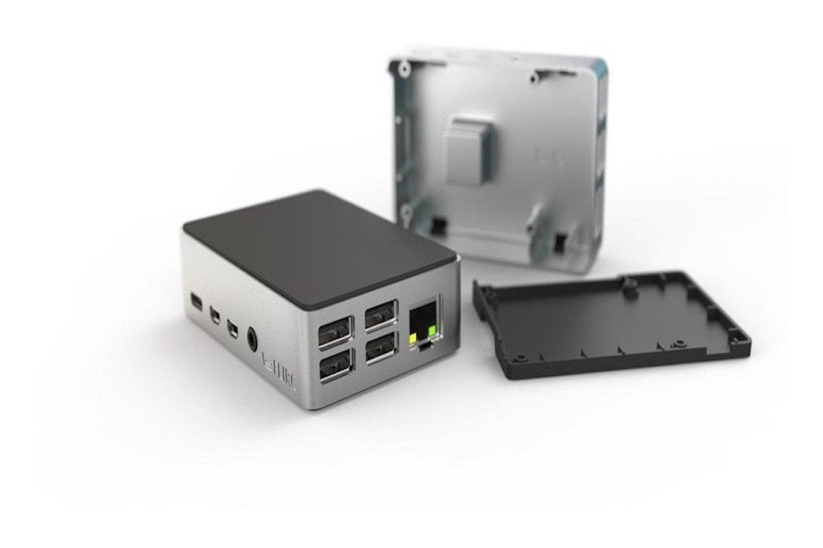 Compact aluminum Flirc case for Raspberry Pi 4 with ventilation, showing open top and bottom panels for electronic. - Kit Raspberry Pi 4 Flirc - Microbot México - 1GB